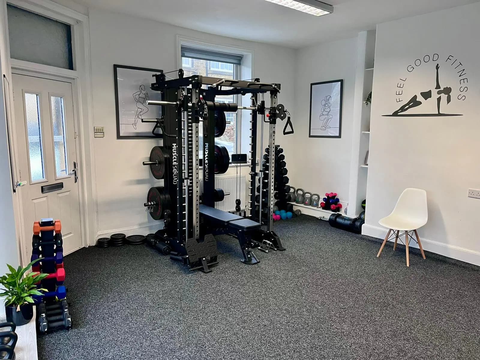 Professional private gym studio in Bradford featuring a MuscleSquad power rack and personalized branding